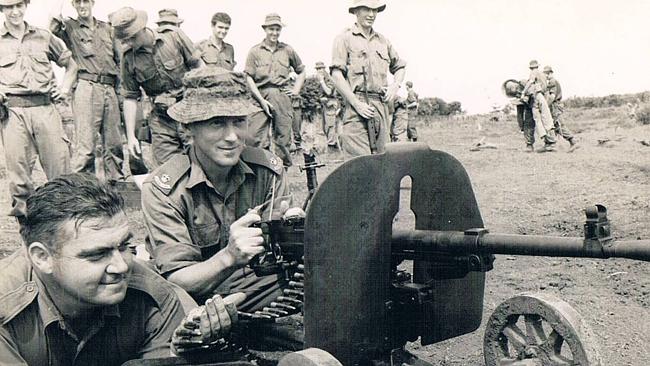 Jack Kirby and Harry Smith with a captured enemy machinegun