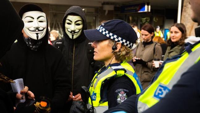 Anarchists wearing Guy Fawkes masks